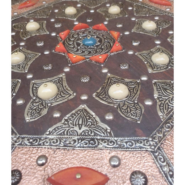 A new arrival. This beautiful resin and metal inlaid Moroccan side table measures approximately 20" x 17.5". Amazing...