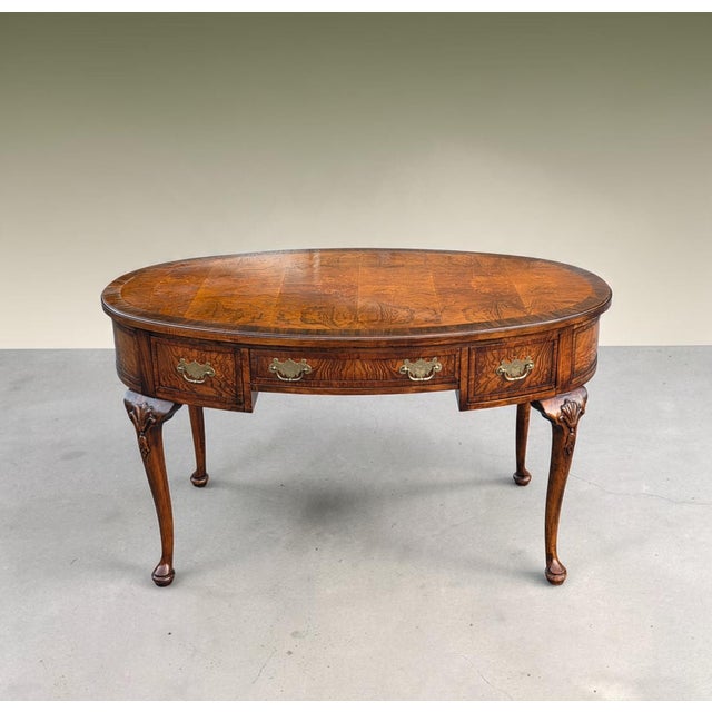 Late-20th-century Hekman Queen Anne Revival writing desk, crafted with richly figured walnut burl veneer and an...