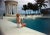Slim Aarons, CZ by the Pool, Estate Stamped Photographic Print, 1955 / 2020s For Sale
