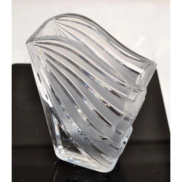 This stunning vase features ribbed, fluted and fan detailing with a splash effect all executed in fine handblown crystal...