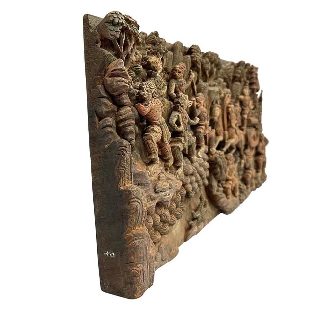 Wonderful hand carved wooden wall plaque with intricate detail of a scene from Ramayana. According to the Hindu epic...