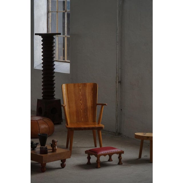 An elegant antique-style stool or footstool, this piece features a finely carved wooden frame and traditional detailing...