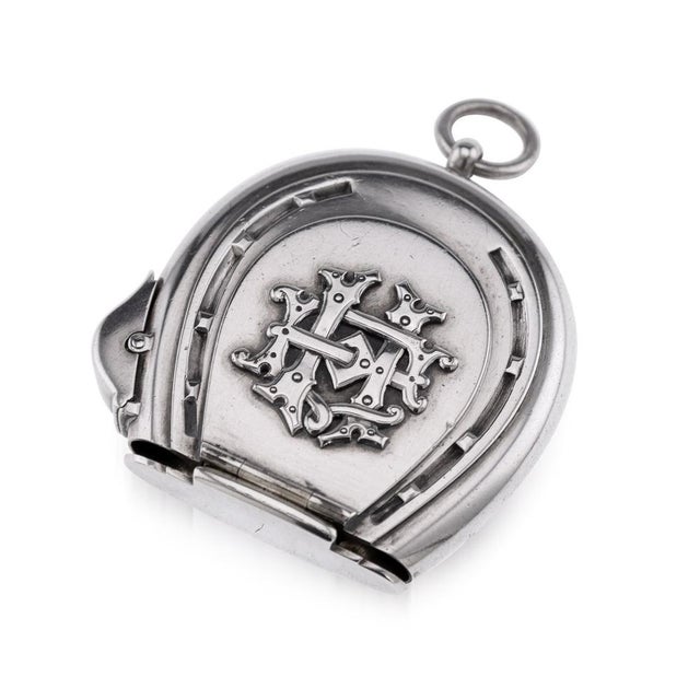 Antique mid-19th century very rare victorian solid silver vesta case and lighter, in a shape of a horseshoe, opening on...