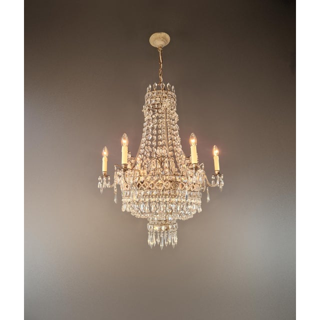 An extraordinary Rococo-style masterpiece: this magnificent French chandelier, crafted in 1910, is a unique piece that...