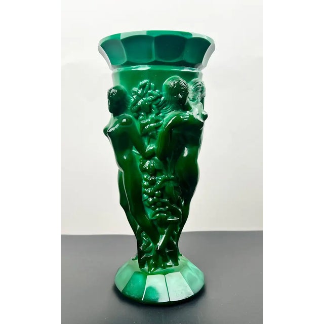 This striking Art Deco vase, attributed to Curt Schlevogt, exemplifies the sculptural elegance and modernist refinement of...