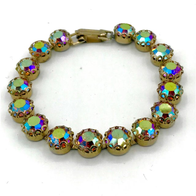 This is part of Chairish’s Costume Jewelry assortment. A classic. Colorful Weiss Aurora Borealis pronged tennis bracelet....