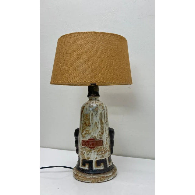 A stunning vintage earthenware /ceramic table lamp base from the mid - 20 Century. The lamp base features the iconic...