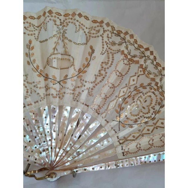 A beautiful late 19th-century European hand fan dating to circa the 1890s, distinguished by its delicately embroidered...