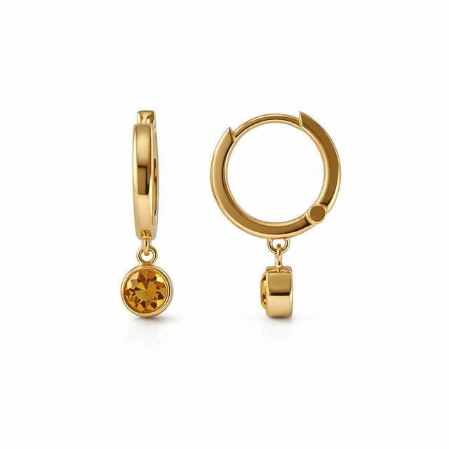 Citrine Drop Huggie Hoop Earrings These refined earrings feature a pair of elegant citrine gemstones delicately suspended...