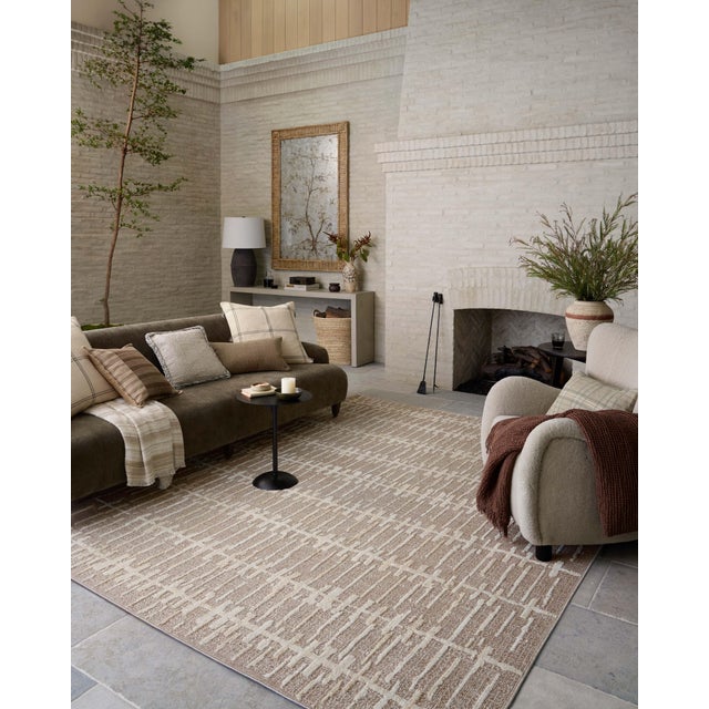 The Bexley Collection is a modern area rug with a loosely structured, organic design from Amber Lewis x Loloi. The rug...