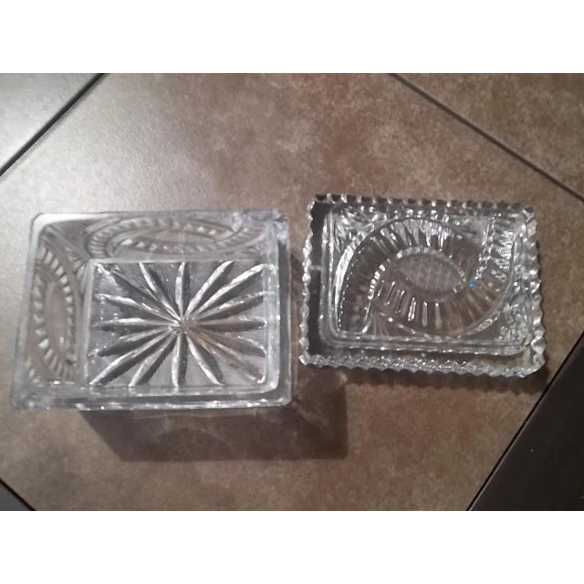 Beautifully etched box shaped cut crystal ashtray. It has the a beautiful art deco design. the bottom has a star burst...