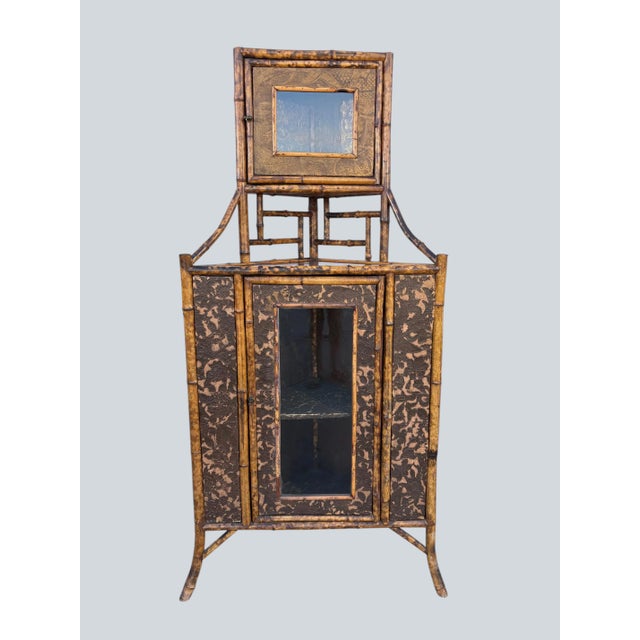 A 19th- century Bamboo Corner Cabinet. Two cupboards decorated with Victorian embossed hard paper. Real bamboo.
