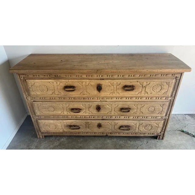 18th-century Italian three-drawer commode, monumental in size and crafted in walnut, is a significant piece of historical...