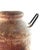 Heavy terracotta vase with warm reddish-brown hue that exudes a rustic charm, while the metal handles introduce a...