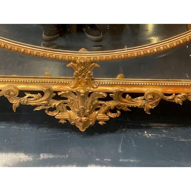 The 19th c. French Louis XV Giltwood Over Mantel Mirror is a stunning piece of home decor that exudes elegance and...
