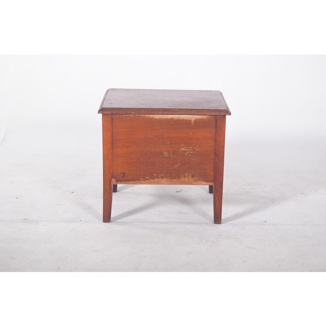 Wooden antique cabinet. With a minimalist design and compact rectangular structure, the piece of furniture has a hinged...