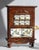 An antique wooden spice cabinet made in the Netherlands. The beautiful kitchen cabinet has 8 ceramic drawers with hand...