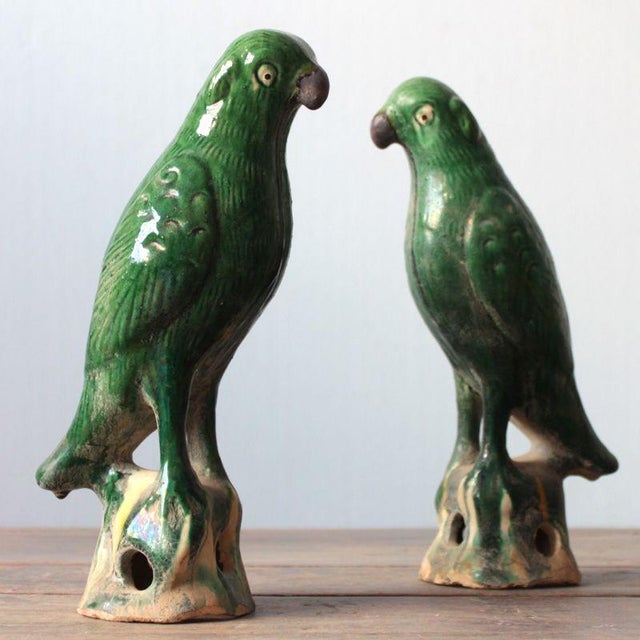 This charming pair of vintage green glazed parrot figures brings a touch of history to any interior. Each bird is finely...