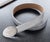 An elegant, chic vintage Prada belt crafted in the house's iconic silver Saffiano leather, celebrated for its distinctive...