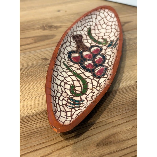 The long, boat-shaped format paired with a glossy crackle-glazed grape motif fits directly into popular rustic, Tuscan,...
