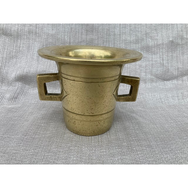 Antique polished bronze mortar with two side handles and a great patina. Heavy. No marks. Has wear consistent with age and...