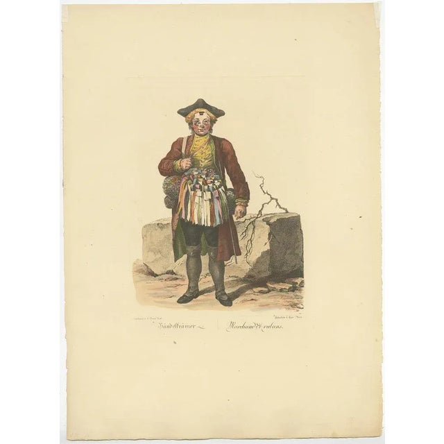 Antique print titled 'Bändelkrämer - Marchand de Rubans'. Old profession print depicting a ribbon merchant. This print...