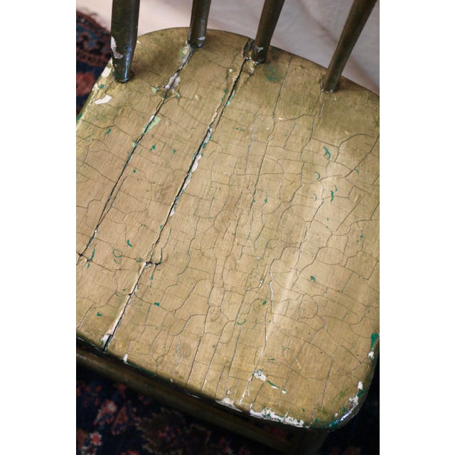 Amazing older gold painted chair. Flared spindles. Rustic paint is chippy showing white and green paint underneath....