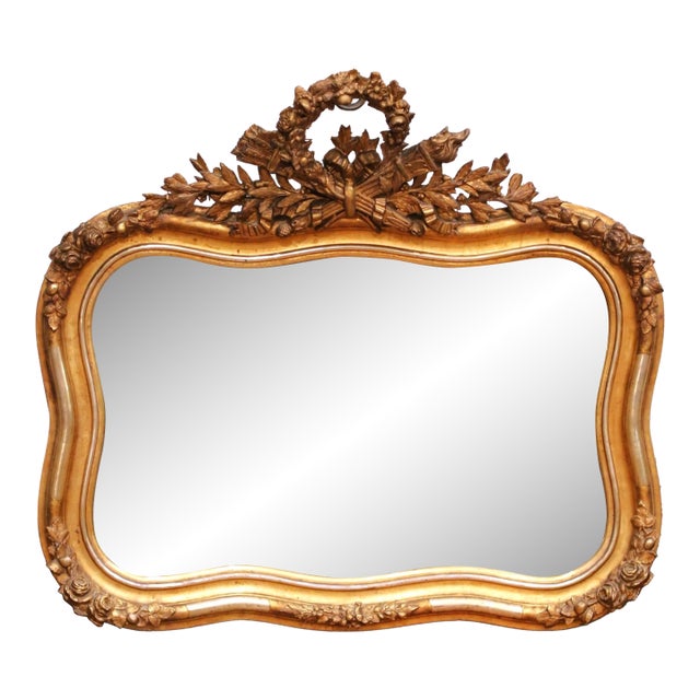 19th Century French Louis XV Giltwood Wall Mirror With Floral Crest For Sale