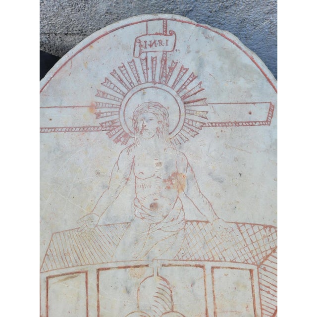 Stele or oval block of white marble, engraved with the motif of Christ of the Resurrection. This type of element is found...