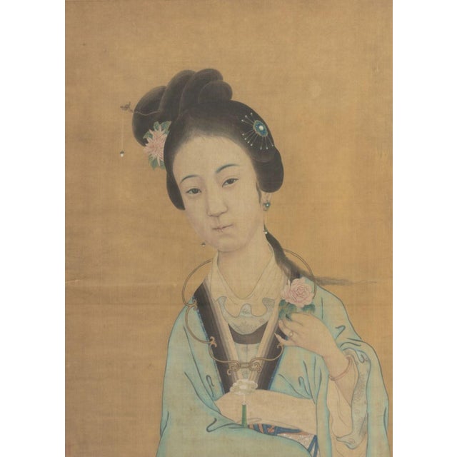 Chinese School, Portrait of a Woman, Gouache on Silk, depicting a woman in blue dress holding a flower, ebonized and...