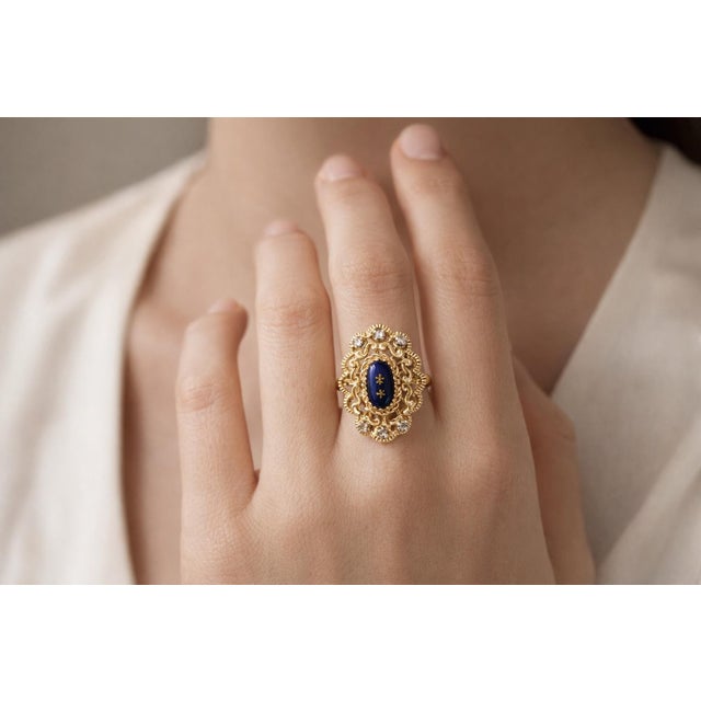 Discover the timeless elegance of our Antique Yellow Gold and Blue Enamel Ring, meticulously crafted from 18k yellow gold...