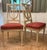 An elegant pair of French Louis XVI revival side chairs executed with carved open lyre-form backs. Versatile chairs that...