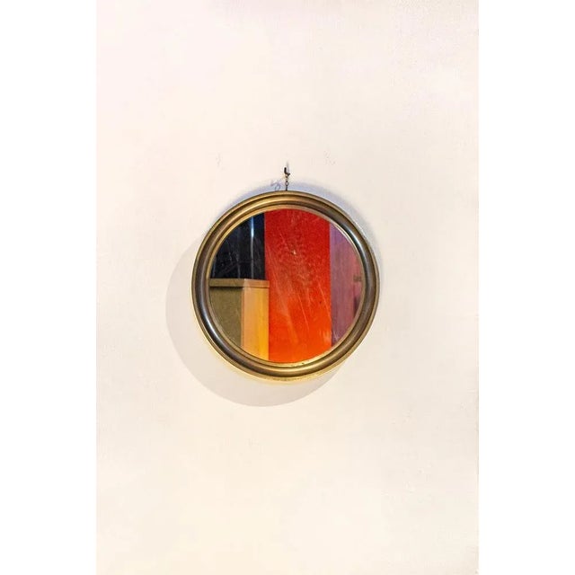 Mirror with brass frame. Narcissus model Designer Sergio Mazza Artemide manufacturer 60's I have official proof of...