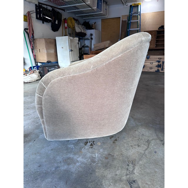1970s pair of Ward Bennett for Brickel Associates barrel lounge chairs in fabric on castors. Each chair measures 32 inches...