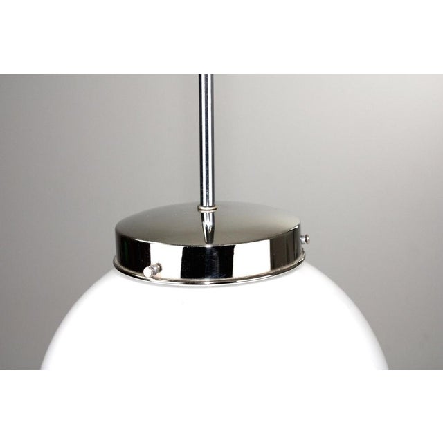 Hanging made of chrome-plated brass, ball made of white glossy opal layer glass. European Plug (up to 250V).The wiring of...