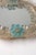 This small vintage Venetian Murano glass wall mirror is a charming example of traditional Italian craftsmanship. Crafted...