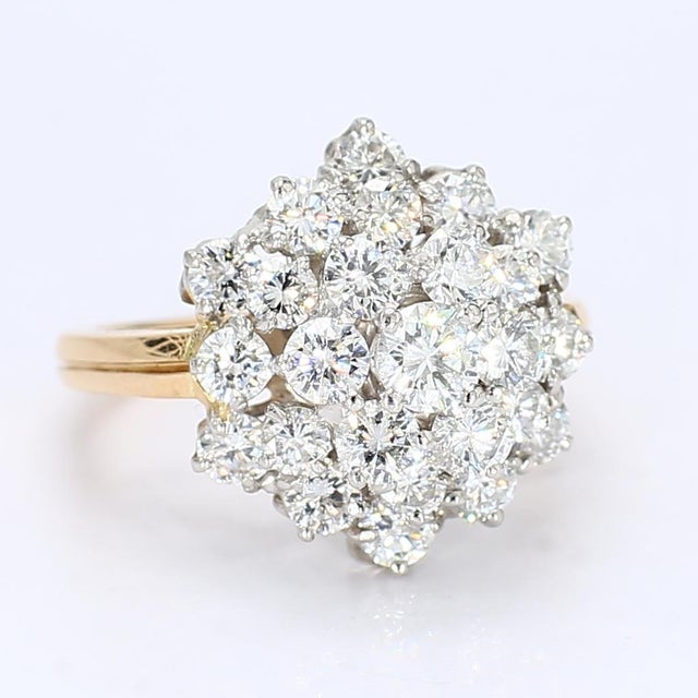 This 18k yellow & white gold cocktail ring by Oscar Heyman is sure to catch even the least attentive persons eye. It...