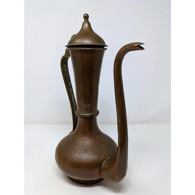 This antique Russian copper teapot is a stunning piece with a unique double marking. It boasts a rich patina that adds to...