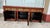 Hand-painted Chinese sideboard is constructed from wood with a distressed red and black lacquer finish. It has five...