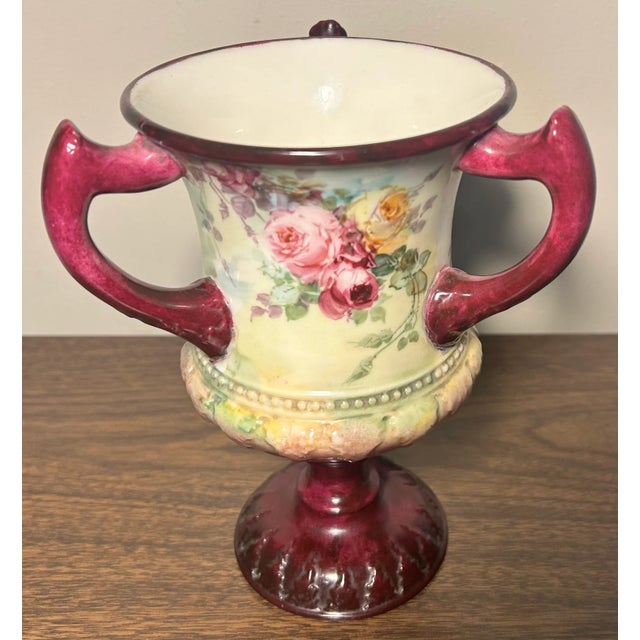 Up for sale is an 1889-1906 American Ceramic Art Studio Belleek Porcelain Hand Painted Rose Motifs Loving Cup Vase! It...
