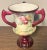 Up for sale is an 1889-1906 American Ceramic Art Studio Belleek Porcelain Hand Painted Rose Motifs Loving Cup Vase! It...