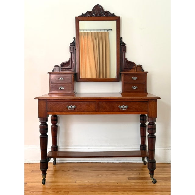 Circa 1850s Victorian dressing table or writing desk with drawers and mirror. Original silver-colored handles are a rare...