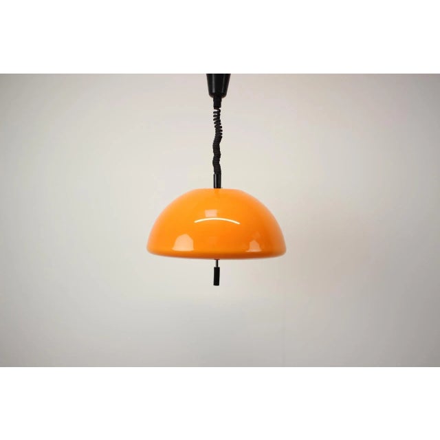 Vintage adjustable, space age pendant, designed by Guzzini for Meblo in the 1970s. Good vintage condition. The max height...
