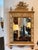 Louis XVI style mirror by LaBarge featuring a carved and gilded neoclassical crest with birds and musical trophies. The...