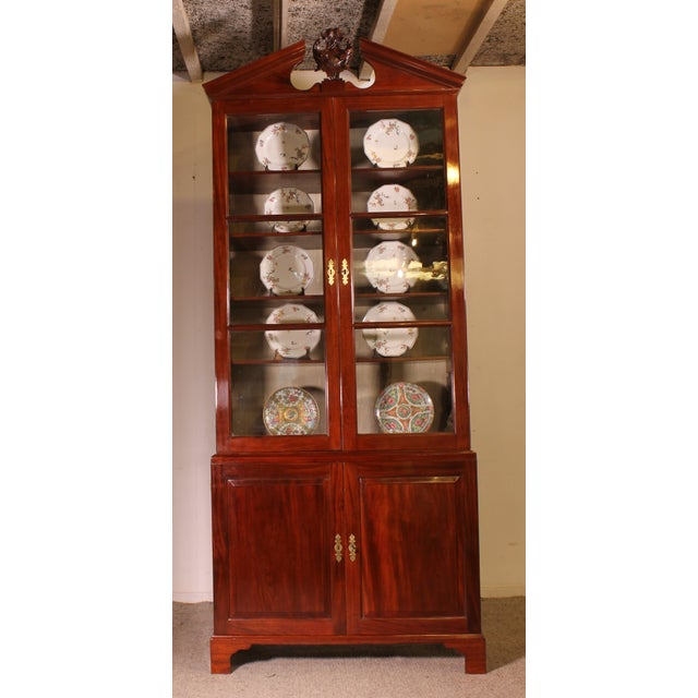 Superb and rare 18th century English mahogany bookcase from the George III period with capital. The bookcases with 18th...