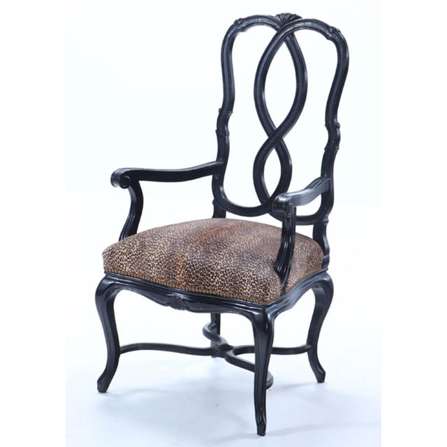 Twelve ebonized large scale dining chairs with faux leopard upholstery C 1950. Very well made French in the Venetian style...