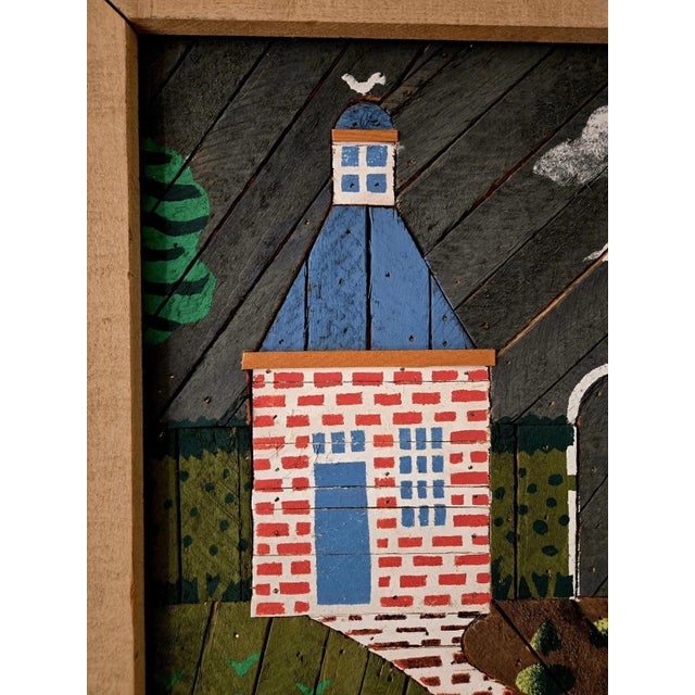 This lathe-art panel is of a garden scene, made with a herringbone-pattern grey background, with simple trees painted...