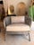 Contemporary organic lounge chair featuring a sculptural rattan frame in a weathered greige finish that creates an airy,...