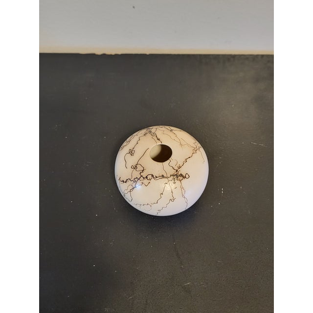 Estate find. Horsehair ceramic bud vase vessel features a rounded, bulbous form with a petite, rounded opening at the top....