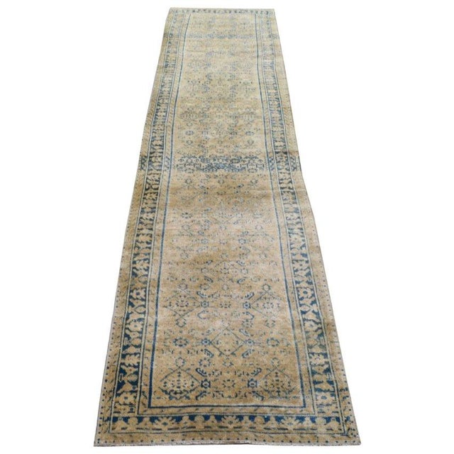 Hand-knotted with care using traditional rug-making techniques, this wool rug blends timeless craftsmanship with a modern...